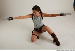 Woman Adult Average Fighting with gun Kneeling poses Casual Latino